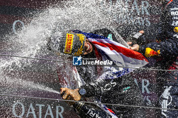 2024-07-07 - Lewis Hamilton (GBR) - Mercedes-AMG PETRONAS F1 Team - Mercedes W15 - Mercedes E Performance on the podium after winning the Race on day 4, Sunday july 7, 2024 of the formula 1 qatar airways british grand prix 2024, scheduled to take place at the silverstone circuit from july 5 to july 7, 2024 - FORMULA 1 - QATAR AIRWAYS BRITISHGRAND PRIX 2024 - RACE - FORMULA 1 - MOTORS