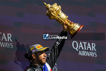 2024-07-07 - Lewis Hamilton (GBR) - Mercedes-AMG PETRONAS F1 Team - Mercedes W15 - Mercedes E Performance on the podium after winning the Race on day 4, Sunday july 7, 2024 of the formula 1 qatar airways british grand prix 2024, scheduled to take place at the silverstone circuit from july 5 to july 7, 2024 - FORMULA 1 - QATAR AIRWAYS BRITISHGRAND PRIX 2024 - RACE - FORMULA 1 - MOTORS