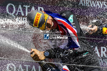 2024-07-07 - Lewis Hamilton (GBR) - Mercedes-AMG PETRONAS F1 Team - Mercedes W15 - Mercedes E Performance on the podium after winning the Race on day 4, Sunday july 7, 2024 of the formula 1 qatar airways british grand prix 2024, scheduled to take place at the silverstone circuit from july 5 to july 7, 2024 - FORMULA 1 - QATAR AIRWAYS BRITISHGRAND PRIX 2024 - RACE - FORMULA 1 - MOTORS