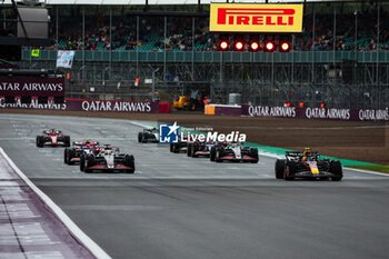 2024-07-05 - Practice starts: 20 MAGNUSSEN Kevin (den), Haas F1 Team VF-24 Ferrari, 11 PEREZ Sergio (mex), Red Bull Racing RB20, action during the Formula 1 Qatar Airways British Grand Prix 2024, 12th round of the 2024 Formula One World Championship from July 5 to 7, 2024 on the Silverstone Circuit, in Silverstone, United Kingdom - F1 - BRITISH GRAND PRIX 2024 - FORMULA 1 - MOTORS