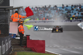 2024-07-06 - marshall, commissaire de piste, marshal, marshalls, marshals red flag, drapeau yellow during the Formula 1 Qatar Airways British Grand Prix 2024, 12th round of the 2024 Formula One World Championship from July 5 to 7, 2024 on the Silverstone Circuit, in Silverstone, United Kingdom - F1 - BRITISH GRAND PRIX 2024 - FORMULA 1 - MOTORS