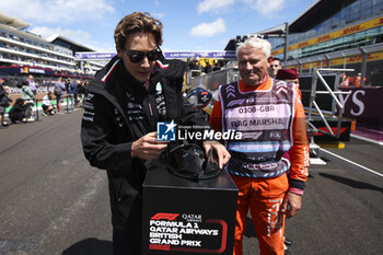 2024-07-07 - FIA marshall, commissaire de piste, marshal, marshalls, marshals award portrait RUSSELL George (gbr), Mercedes AMG F1 Team W15, portrait during the Formula 1 Qatar Airways British Grand Prix 2024, 12th round of the 2024 Formula One World Championship from July 5 to 7, 2024 on the Silverstone Circuit, in Silverstone, United Kingdom - F1 - BRITISH GRAND PRIX 2024 - FORMULA 1 - MOTORS