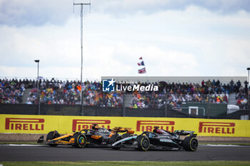 2024-07-07 - 63 RUSSELL George (gbr), Mercedes AMG F1 Team W15, 81 PIASTRI Oscar (aus), McLaren F1 Team MCL38, action during the Formula 1 Qatar Airways British Grand Prix 2024, 12th round of the 2024 Formula One World Championship from July 5 to 7, 2024 on the Silverstone Circuit, in Silverstone, United Kingdom - F1 - BRITISH GRAND PRIX 2024 - FORMULA 1 - MOTORS