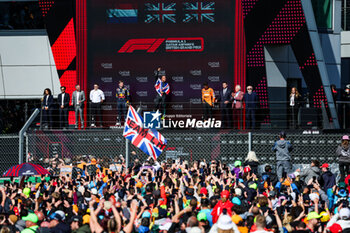 2024-07-07 - Podium: HAMILTON Lewis (gbr), Mercedes AMG F1 Team W15, VERSTAPPEN Max (ned), Red Bull Racing RB20, NORRIS Lando (gbr), McLaren F1 Team MCL38, BEN SULAYEM Mohammed (uae), President of the FIA, during the Formula 1 Qatar Airways British Grand Prix 2024, 12th round of the 2024 Formula One World Championship from July 5 to 7, 2024 on the Silverstone Circuit, in Silverstone, United Kingdom - F1 - BRITISH GRAND PRIX 2024 - FORMULA 1 - MOTORS