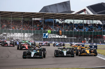 2024-07-07 - start of the race, depart, 63 RUSSELL George (gbr), Mercedes AMG F1 Team W15, action 44 HAMILTON Lewis (gbr), Mercedes AMG F1 Team W15, action 04 NORRIS Lando (gbr), McLaren F1 Team MCL38, action during the Formula 1 Qatar Airways British Grand Prix 2024, 12th round of the 2024 Formula One World Championship from July 5 to 7, 2024 on the Silverstone Circuit, in Silverstone, United Kingdom - F1 - BRITISH GRAND PRIX 2024 - FORMULA 1 - MOTORS