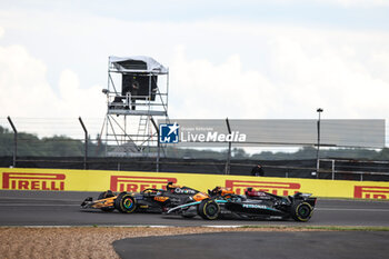 2024-07-07 - 81 PIASTRI Oscar (aus), McLaren F1 Team MCL38, action 63 RUSSELL George (gbr), Mercedes AMG F1 Team W15, action during the Formula 1 Qatar Airways British Grand Prix 2024, 12th round of the 2024 Formula One World Championship from July 5 to 7, 2024 on the Silverstone Circuit, in Silverstone, United Kingdom - F1 - BRITISH GRAND PRIX 2024 - FORMULA 1 - MOTORS