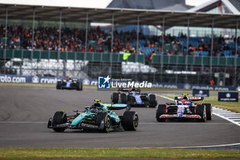 2024-07-07 - 14 ALONSO Fernando (spa), Aston Martin F1 Team AMR24, action 22 TSUNODA Yuki (jap), Visa Cash App RB F1 Team VCARB 01, action during the Formula 1 Qatar Airways British Grand Prix 2024, 12th round of the 2024 Formula One World Championship from July 5 to 7, 2024 on the Silverstone Circuit, in Silverstone, United Kingdom - F1 - BRITISH GRAND PRIX 2024 - FORMULA 1 - MOTORS