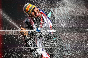 2024-07-07 - HAMILTON Lewis (gbr), Mercedes AMG F1 Team W15, portrait celebration podium with Ferrari champagne during the Formula 1 Qatar Airways British Grand Prix 2024, 12th round of the 2024 Formula One World Championship from July 5 to 7, 2024 on the Silverstone Circuit, in Silverstone, United Kingdom - F1 - BRITISH GRAND PRIX 2024 - FORMULA 1 - MOTORS