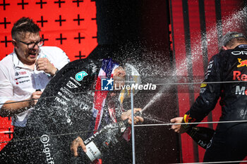 2024-07-07 - HAMILTON Lewis (gbr), Mercedes AMG F1 Team W15, portrait celebration podium with Ferrari champagne VERSTAPPEN Max (ned), Red Bull Racing RB20, portrait Peter 'Bono' Bonnington, senior race engineer for Lewis Hamilton during the Formula 1 Qatar Airways British Grand Prix 2024, 12th round of the 2024 Formula One World Championship from July 5 to 7, 2024 on the Silverstone Circuit, in Silverstone, United Kingdom - F1 - BRITISH GRAND PRIX 2024 - FORMULA 1 - MOTORS