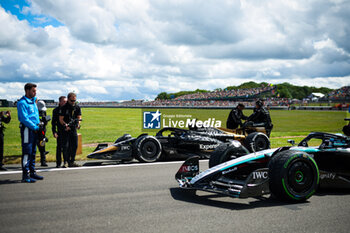 2024-07-07 - 63 RUSSELL George (gbr), Mercedes AMG F1 Team W15, and the Modified F2 car prepared by Mercedes Applied Science and Carlin for the fictional Apex APXGP team in the F1 movie by Apple Studios / Bruckheimer Films, during the Formula 1 Qatar Airways British Grand Prix 2024, 12th round of the 2024 Formula One World Championship from July 5 to 7, 2024 on the Silverstone Circuit, in Silverstone, United Kingdom - F1 - BRITISH GRAND PRIX 2024 - FORMULA 1 - MOTORS