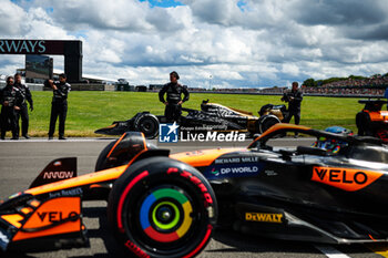 2024-07-07 - PIASTRI Oscar (aus), McLaren F1 Team MCL38, and the Modified F2 car prepared by Mercedes Applied Science and Carlin for the fictional Apex APXGP team in the F1 movie by Apple Studios / Bruckheimer Films, during the Formula 1 Qatar Airways British Grand Prix 2024, 12th round of the 2024 Formula One World Championship from July 5 to 7, 2024 on the Silverstone Circuit, in Silverstone, United Kingdom - F1 - BRITISH GRAND PRIX 2024 - FORMULA 1 - MOTORS