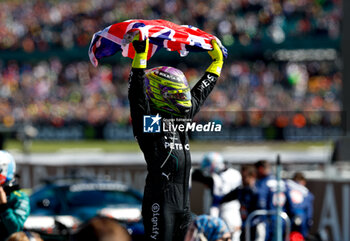 2024-07-07 - HAMILTON Lewis (gbr), Mercedes AMG F1 Team W15, portrait celebrates his victory during the Formula 1 Qatar Airways British Grand Prix 2024, 12th round of the 2024 Formula One World Championship from July 5 to 7, 2024 on the Silverstone Circuit, in Silverstone, United Kingdom - F1 - BRITISH GRAND PRIX 2024 - FORMULA 1 - MOTORS