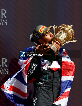 2024-07-07 - HAMILTON Lewis (gbr), Mercedes AMG F1 Team W15, portrait celebration podium trophy during the Formula 1 Qatar Airways British Grand Prix 2024, 12th round of the 2024 Formula One World Championship from July 5 to 7, 2024 on the Silverstone Circuit, in Silverstone, United Kingdom - F1 - BRITISH GRAND PRIX 2024 - FORMULA 1 - MOTORS