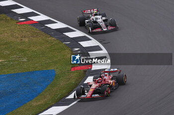 2024-07-07 - 16 LECLERC Charles (mco), Scuderia Ferrari SF-24, action and 27 HULKENBERG Nico (ger), Haas F1 Team VF-24 Ferrari, action during the Formula 1 Qatar Airways British Grand Prix 2024, 12th round of the 2024 Formula One World Championship from July 5 to 7, 2024 on the Silverstone Circuit, in Silverstone, United Kingdom - F1 - BRITISH GRAND PRIX 2024 - FORMULA 1 - MOTORS