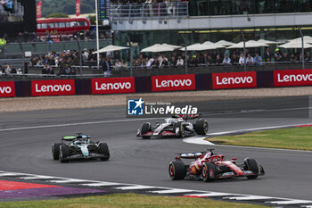 2024-07-07 - 16 LECLERC Charles (mco), Scuderia Ferrari SF-24, action, 18 STROLL Lance (can), Aston Martin F1 Team AMR24, action and 27 HULKENBERG Nico (ger), Haas F1 Team VF-24 Ferrari, action during the Formula 1 Qatar Airways British Grand Prix 2024, 12th round of the 2024 Formula One World Championship from July 5 to 7, 2024 on the Silverstone Circuit, in Silverstone, United Kingdom - F1 - BRITISH GRAND PRIX 2024 - FORMULA 1 - MOTORS