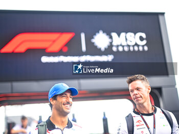 2024-07-20 - #3 Daniel Ricciardo Of The Team Visa Cash App Rb Formula One Team, VCARB Honda 01 And #27 Nicolas Hulkenberg Of The Team Moneygram Haas F1 Team, Haas Ferrari VF-24In Paddock During Fia Formula One World Championship F1 Hungarian Grand Prix 2024, 20 July In Budapest, Hungarian - FORMULA 1 HUNGARIAN GRAND PRIX 2024 - PRACTICE 3  - FORMULA 1 - MOTORS