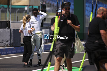 2024-07-18 - APX GP Team crew filming in the paddock for the Apex F1 movie by Apple Studios / Bruckheimer Films during the Formula 1 Hungarian Grand Prix 2024, 13th round of the 2024 Formula One World Championship from July 19 to 21, 2024 on the Hungaroring, in Mogyorod, Hungary - F1 - HUNGARIAN GRAND PRIX 2024 - FORMULA 1 - MOTORS