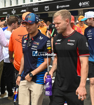 2024-07-21 - Sergio Perez (MEX) - Oracle Red Bull Racing - Red Bull RB20 - Honda RBPT an Kevin Magnussen (DEN) - MoneyGram Haas F1 Team - Haas VF-24 - Ferrari during Raceday on Sunday, July 21, of Formula 1 Hungarian Grand Prix 2024, scheduled to take place at Hungaroring track in Mogyorod, Budapest, Hungary, july 19 to july 21, 2024 - FORMULA 1 HUNGARIAN GRAND PRIX 2024 - RACE - FORMULA 1 - MOTORS