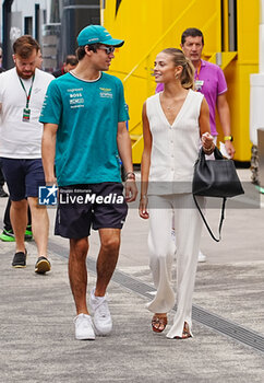 2024-07-21 - Lance Stroll (CAN) - Aston Martin Aramco F1 Team - Aston Martin AMR24 - Mercedes and his girlfriend Sara Pagliaroli (ITA) Model, during Raceday on Sunday, July 21, of Formula 1 Hungarian Grand Prix 2024, scheduled to take place at Hungaroring track in Mogyorod, Budapest, Hungary, july 19 to july 21, 2024 - FORMULA 1 HUNGARIAN GRAND PRIX 2024 - RACE - FORMULA 1 - MOTORS