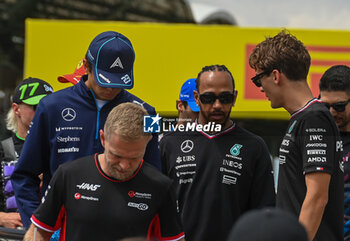 2024-07-21 - George Russell (GBR) chatting wit Lewis Hamilton (GBR) - Mercedes-AMG PETRONAS F1 Team - Mercedes W15 - Mercedes E Performance during driver parade on Raceday on Sunday, July 21, of Formula 1 Hungarian Grand Prix 2024, scheduled to take place at Hungaroring track in Mogyorod, Budapest, Hungary, july 19 to july 21, 2024 - FORMULA 1 HUNGARIAN GRAND PRIX 2024 - RACE - FORMULA 1 - MOTORS