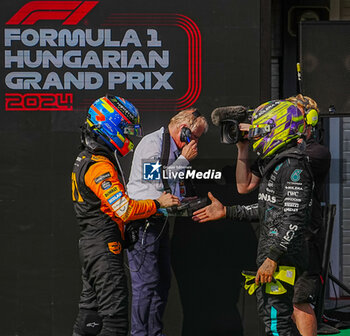 2024-07-21 - Oscar Piastri (AUS) - McLaren Formula 1 Team - McLaren MCL38 - Mercedes
 an Lewis Hamilton (GBR) - Mercedes-AMG PETRONAS F1 Team - Mercedes W15 - Mercedes E Performance during Raceday on Sunday, July 21, of Formula 1 Hungarian Grand Prix 2024, scheduled to take place at Hungaroring track in Mogyorod, Budapest, Hungary, july 19 to july 21, 2024 - FORMULA 1 HUNGARIAN GRAND PRIX 2024 - RACE - FORMULA 1 - MOTORS