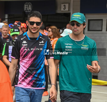 2024-07-21 - Esteban Ocon (FRA) - Alpine F1 Team - Alpine A524 - Renault an Lance Stroll (CAN) - Aston Martin Aramco F1 Team - Aston Martin AMR24 - Mercedes during Raceday on Sunday, July 21, of Formula 1 Hungarian Grand Prix 2024, scheduled to take place at Hungaroring track in Mogyorod, Budapest, Hungary, july 19 to july 21, 2024 - FORMULA 1 HUNGARIAN GRAND PRIX 2024 - RACE - FORMULA 1 - MOTORS