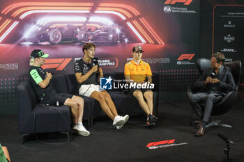 2024-09-19 - RUSSELL George (gbr), Mercedes AMG F1 Team W15, portrait BOTTAS Valtteri (fin), Stake F1 Team Kick Sauber C44, portrait PIASTRI Oscar (aus), McLaren F1 Team MCL38, portrait press conference during the Formula 1 Singapore Grand Prix 2024, 18th round of the 2024 Formula One World Championship from September 20 to 22, 2024 on the Marina Bay Circuit, in Singapore, Singapore - F1 - SINGAPORE GRAND PRIX 2024 - FORMULA 1 - MOTORS