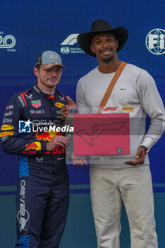 2024-10-18 - Max Verstappen (NED) - Oracle Red Bull Racing - Red Bull RB20 - Honda RBPT and Leo Neugebager (GER) Gold Olympic medal Paris 2024 - during Sprint Qualify of the Formula 1 Pirelli United States Grand Prix 2024, scheduled to take place at Circuit of Americas in Austin, TX (USA) Sept 18-20, 2024 - FORMULA 1 PIRELLI UNITED STATES GRAND PRIX 2024 - SPRINT QUALIFYING - FORMULA 1 - MOTORS