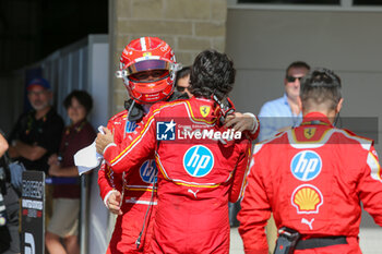 2024-10-20 - Charles Leclerc (MON) - and Carlos Sainz Jr. (ESP) - Scuderia Ferrari - Ferrari SF-24 - Ferrari celebrating during the Race of Formula 1 Pirelli United States Grand Prix 2024, scheduled to take place at Circuit of Americas in Austin, TX (USA) Sept 18-20, 2024 - FORMULA 1 PIRELLI UNITED STATES GRAND PRIX 2024 - RACE - FORMULA 1 - MOTORS