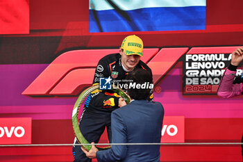 2024-11-03 - Max Verstappen (NED) - Oracle Red Bull Racing - Red Bull RB20 - Honda RBPT on the podium after the Formula 1 Lenovo Grande Premio de Sao Paulo 2024, scheduled to take place at Interlagos Circuit, San Paolo, Brasil, BRA  Nov 1st-3rd, 2024 - FORMULA 1 LENOVO GRANDE PREMIO DE SAO PAULO 2024 - RACE - FORMULA 1 - MOTORS