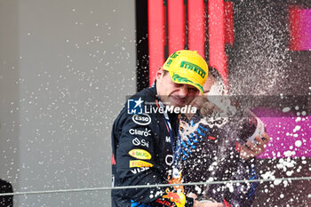 2024-11-03 - Max Verstappen (NED) - Oracle Red Bull Racing - Red Bull RB20 - Honda RBPT on the podium ofter the Formula 1 Lenovo Grande Premio de Sao Paulo 2024, scheduled to take place at Interlagos Circuit, San Paolo, Brasil, BRA  Nov 1st-3rd, 2024 - FORMULA 1 LENOVO GRANDE PREMIO DE SAO PAULO 2024 - RACE - FORMULA 1 - MOTORS