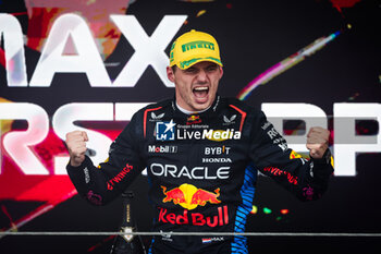 03/11/2024 - VERSTAPPEN Max (ned), Red Bull Racing RB20, portrait celebrating victory on the podium during the Formula 1 Grande Premio de Sao Paulo 2024, 21th round of the 2024 Formula One World Championship from November 1 to 3, 2024 on the Interlagos Circuit, in Sao Paulo, Brazil - F1 - SAO PAULO GRAND PRIX 2024 - FORMULA 1 - MOTORI