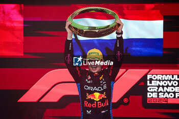 03/11/2024 - VERSTAPPEN Max (ned), Red Bull Racing RB20, portrait celebrating victory on the podium during the Formula 1 Grande Premio de Sao Paulo 2024, 21th round of the 2024 Formula One World Championship from November 1 to 3, 2024 on the Interlagos Circuit, in Sao Paulo, Brazil - F1 - SAO PAULO GRAND PRIX 2024 - FORMULA 1 - MOTORI