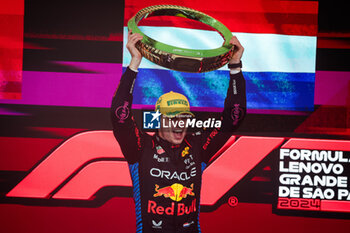 03/11/2024 - VERSTAPPEN Max (ned), Red Bull Racing RB20, portrait celebrating victory on the podium during the Formula 1 Grande Premio de Sao Paulo 2024, 21th round of the 2024 Formula One World Championship from November 1 to 3, 2024 on the Interlagos Circuit, in Sao Paulo, Brazil - F1 - SAO PAULO GRAND PRIX 2024 - FORMULA 1 - MOTORI