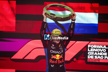 03/11/2024 - VERSTAPPEN Max (ned), Red Bull Racing RB20, portrait celebrating victory on the podium during the Formula 1 Grande Premio de Sao Paulo 2024, 21th round of the 2024 Formula One World Championship from November 1 to 3, 2024 on the Interlagos Circuit, in Sao Paulo, Brazil - F1 - SAO PAULO GRAND PRIX 2024 - FORMULA 1 - MOTORI