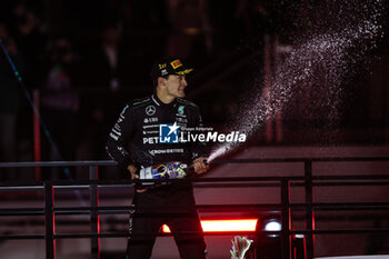 2024-11-24 - RUSSELL George (gbr), Mercedes AMG F1 Team W15, portrait celebrates his victory podium during the Formula 1 Heineken Silver Las Vegas Grand Prix 2024, 22th round of the 2024 Formula One World Championship from November 21 to 23, 2024 on the Las Vegas Strip Circuit, in Las Vegas, United States of America - F1 - LAS VEGAS GRAND PRIX 2024 - FORMULA 1 - MOTORS