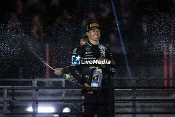 2024-11-24 - RUSSELL George (gbr), Mercedes AMG F1 Team W15, portrait celebrates his victory podium during the Formula 1 Heineken Silver Las Vegas Grand Prix 2024, 22th round of the 2024 Formula One World Championship from November 21 to 23, 2024 on the Las Vegas Strip Circuit, in Las Vegas, United States of America - F1 - LAS VEGAS GRAND PRIX 2024 - FORMULA 1 - MOTORS