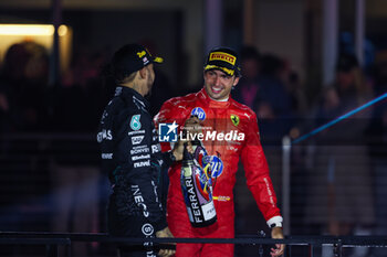 2024-11-24 - podium SAINZ Carlos (spa), Scuderia Ferrari SF-24, HAMILTON Lewis (gbr), Mercedes AMG F1 Team W15, portrait during the Formula 1 Heineken Silver Las Vegas Grand Prix 2024, 22th round of the 2024 Formula One World Championship from November 21 to 23, 2024 on the Las Vegas Strip Circuit, in Las Vegas, United States of America - F1 - LAS VEGAS GRAND PRIX 2024 - FORMULA 1 - MOTORS