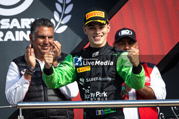 2024-03-02 - MALONEY Zane (bar), Rodin Motorsport, Dallara F2 2024, portrait, podium his win in Sprint race during the 1st round of the 2024 FIA Formula 2 Championship from February 29 to March 2, 2023 on the Bahrain International Circuit, in Sakhir, Bahrain - AUTO - FORMULA 2 2024 - BAHRAIN - FORMULA 2 - MOTORS