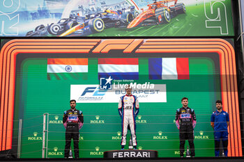 2024-07-20 - VERSCHOOR Richard (nld), Trident, Dallara F2 2024, MAINI Kush (ind), Invicta Racing, Dallara F2 2024, MARTINS Victor (fra), ART Grand Prix, Dallara F2 2024, portrait, podium during the 9th round of the 2024 FIA Formula 2 Championship from July 19 to 21, 2024 on the Hungaroring, in Mogyorod, Hungary - AUTO - FORMULA 2 2024 - HUNGARORING - FORMULA 2 - MOTORS