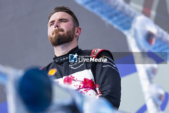 2024-03-16 - ROWLAND Oliver (gbr), Nissan Formula E Team, Nissan e-4ORCE 04, portrait on the podium during the 2024 Sao Paulo ePrix, 3rd meeting of the 2023-24 ABB FIA Formula E World Championship, on the Sao Paulo Street Circuit from March 24 to 26, 2024 in Sao Paulo, Brazil - 2024 FORMULA E SAO PAULO EPRIX - FORMULA E - MOTORS