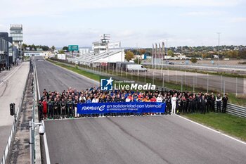 2024-11-05 - Formula e paddock pose for a photo in solidarity with Valencia during the pre-season testing of the 2024-25 ABB FIA Formula E World Championship, on the Circuit del Jarama from November 5 to 8, 2024 in San Sebastián de los Reyes, Spain - 2025 FORMULA E PRE-SEASON TEST - FORMULA E - MOTORS