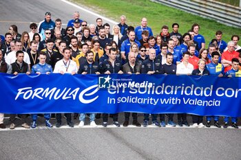 2024-11-05 - Formula e paddock pose for a photo in solidarity with Valencia during the pre-season testing of the 2024-25 ABB FIA Formula E World Championship, on the Circuit del Jarama from November 5 to 8, 2024 in San Sebastián de los Reyes, Spain - 2025 FORMULA E PRE-SEASON TEST - FORMULA E - MOTORS