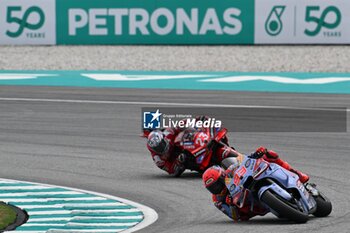 2024-11-02 - Sprint Race of Petronas Grand Prix of Malaysia of MotoGP at Sepang Circuit. November 02 2024 In picture: Marc Marquez and Enea Bastianini Carrera al Sprint del Gran Premio de MotoGP de Malasia en el Circuito Internacional de Sepang. 02 de Noviembre de 2024 POOL/ MotoGP.com / Cordon Press Images will be for editorial use only. Mandatory credit: ?MotoGP.com Cordon Press - SPRINT RACE MOTOGP GRAND PRIX OF MALAYSIA - MOTOGP - MOTORS