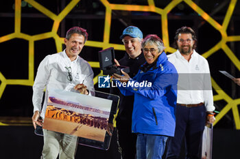 2024-01-19 - Eric Vargiolu getting the Emilie Poucan prize of the most beautiful photo of the year during the Final Podium of the Dakar 2024 on January 19, 2024 in Yanbu, Saudi Arabia - DAKAR 2024 - FINAL PODIUM - RALLY - MOTORS