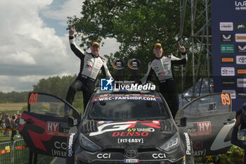 2024-07-21 - Drive Kalle Rovanpera And Co-Driver Jonne Halttunen Of The Team Toyota Gazoo Racing Wrt Are Driving The Toyota Gr Yaris Rally1 Hybrid Celebrating The Final Podium,During Fia World Rally Championship WRC Tet Rally Latvia 2024 21 July Riga Latvia - FIA WORLD RALLY CHAMPIONSHIP  WRC TET RALLY LATVIA 2024 - RALLY - MOTORS