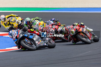 2024-06-15 - Toprak Razgatlioglu (TUR) BMW M 1000 RR, Rokit BMW Motorrad WorldSBK Team and Alvaro Bautista (ESP) Ducati Panigale V4R, Aruba.It Racing - Ducati during FIM Superbike World Championship Pirelli Emilia-Romagna Round at Misano World Circuit, Misano Adriatico, Italy on June 15, 2024 - SBK - SUPERPOLE AND RACE 1 PIRELLI EMILIA-ROMAGNA ROUND - SUPERBIKE - MOTORS