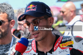 2024-06-15 - (54) Toprak Razgatlioglu from Turkey of ROKiT BMW Motored WorldSBK Team, rides BMW M1000 RR during the FIM Motul Superbike World Championship - Race 1 of Emilia Romagna Round at Marco Simoncelli World Circuit in Misano Adriatico on June 15, 2024 in Misano Adriatico, Rimini, Italy. - PIRELLI EMILIA ROMAGNA ROUND - RACE 1 - SUPERBIKE - MOTORS