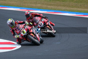 2024-06-15 - (1) Alvaro Bautista from Spain of Aruba.it Ducati Team, rides Ducati Panigale V4R and (11) Nicolo Bulega from Italy of Aruba.it Ducati Team, rides Ducati Panigale V4R in action during the FIM Motul Superbike World Championship - Race 1 of Emilia Romagna Round at Marco Simoncelli World Circuit in Misano Adriatico on June 15, 2024 in Misano Adriatico, Rimini, Italy. - PIRELLI EMILIA ROMAGNA ROUND - RACE 1 - SUPERBIKE - MOTORS