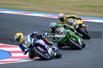 2024-06-15 - (55) Andrea Locatelli from Italy of Pata Prometeon Yamaha Team, rides Yamaha YZF R1 and (22) Alex Lowes from United Kingdom of Kawasaki Racing Team World SBK, rides Kawasaki ZX-10RR in action during the FIM Motul Superbike World Championship - Race 1 of Emilia Romagna Round at Marco Simoncelli World Circuit in Misano Adriatico on June 15, 2024 in Misano Adriatico, Rimini, Italy. - PIRELLI EMILIA ROMAGNA ROUND - RACE 1 - SUPERBIKE - MOTORS